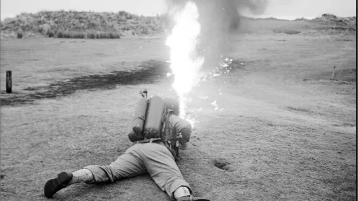 American soldier testing out a flamethrower on Saunton's fairways.jpg