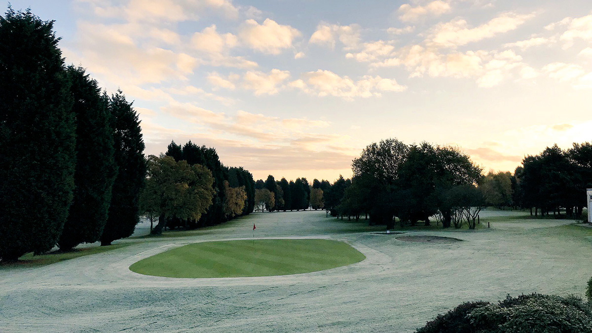 Frost cleared from a green