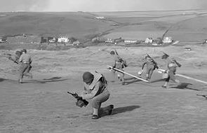 American troops practising at Saunton - the current course manager, Murray Walker, resides in the white house at the far right of this picture.jpg